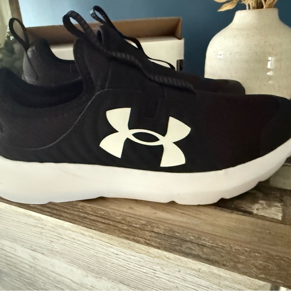Brand new. Under Armour Black and White Athletic Shoes